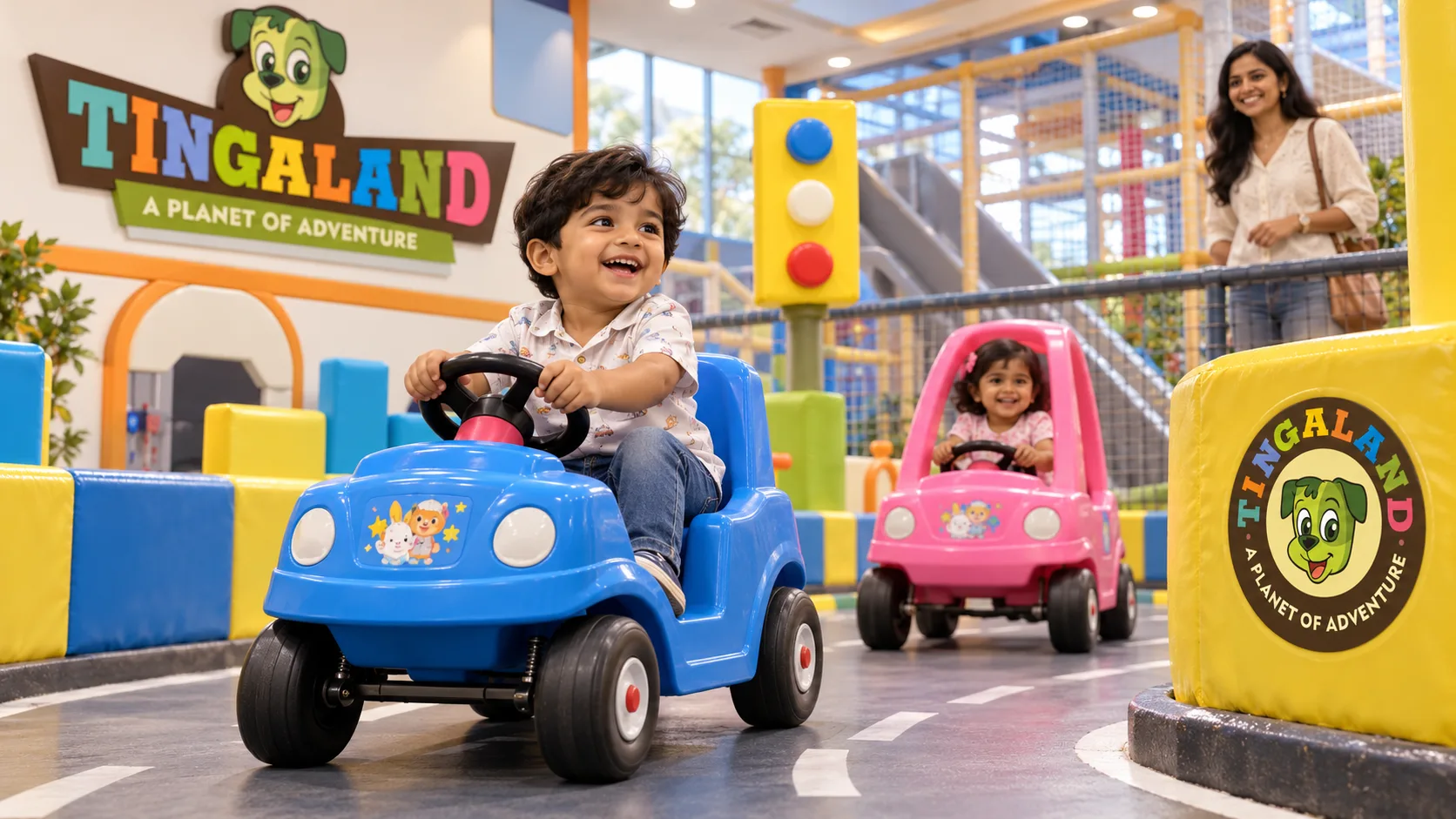 Toddlers driving tingaland kiddy cars with a parent nearby