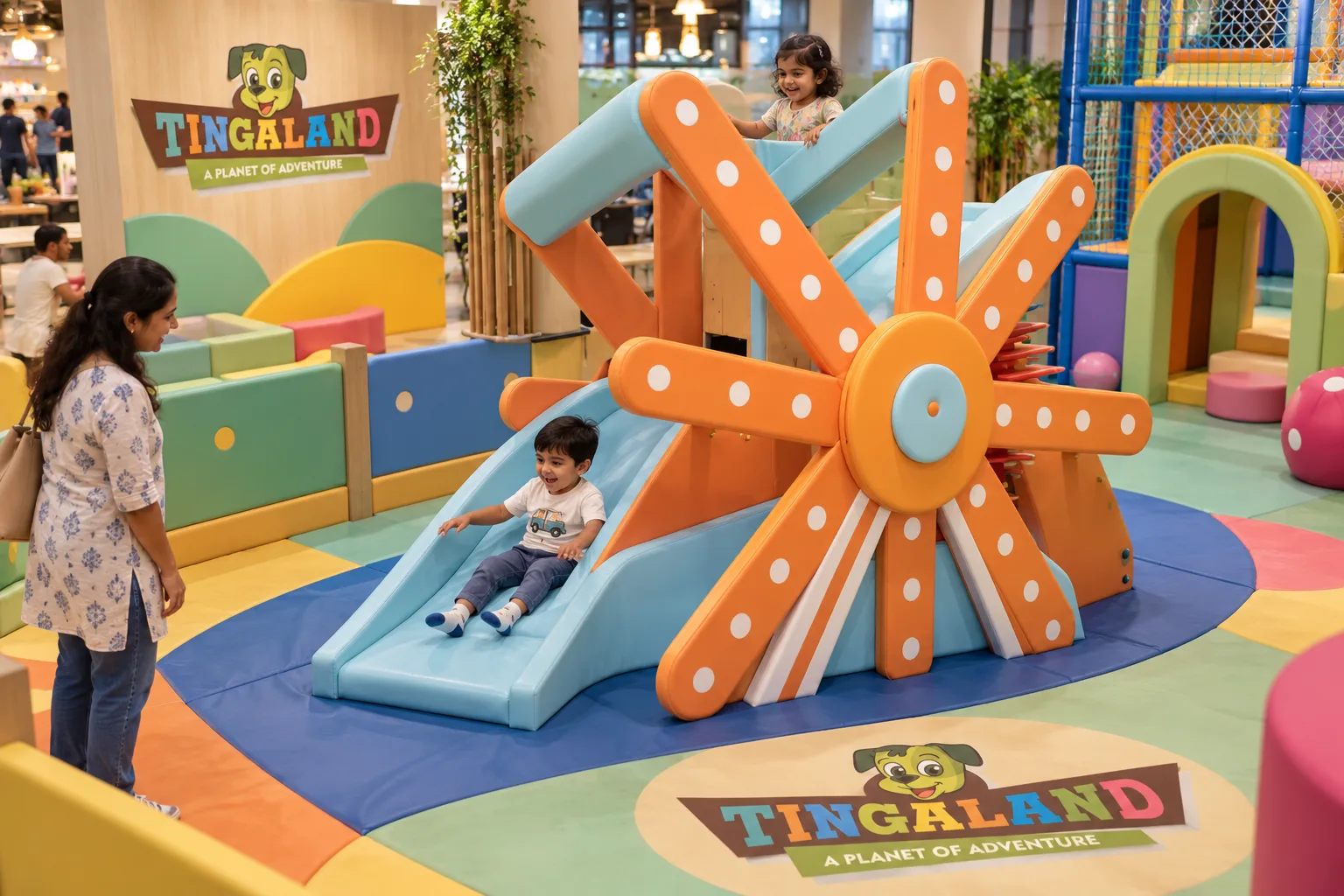Overhead view of toddlers exploring the tingaland ferris wheel slide