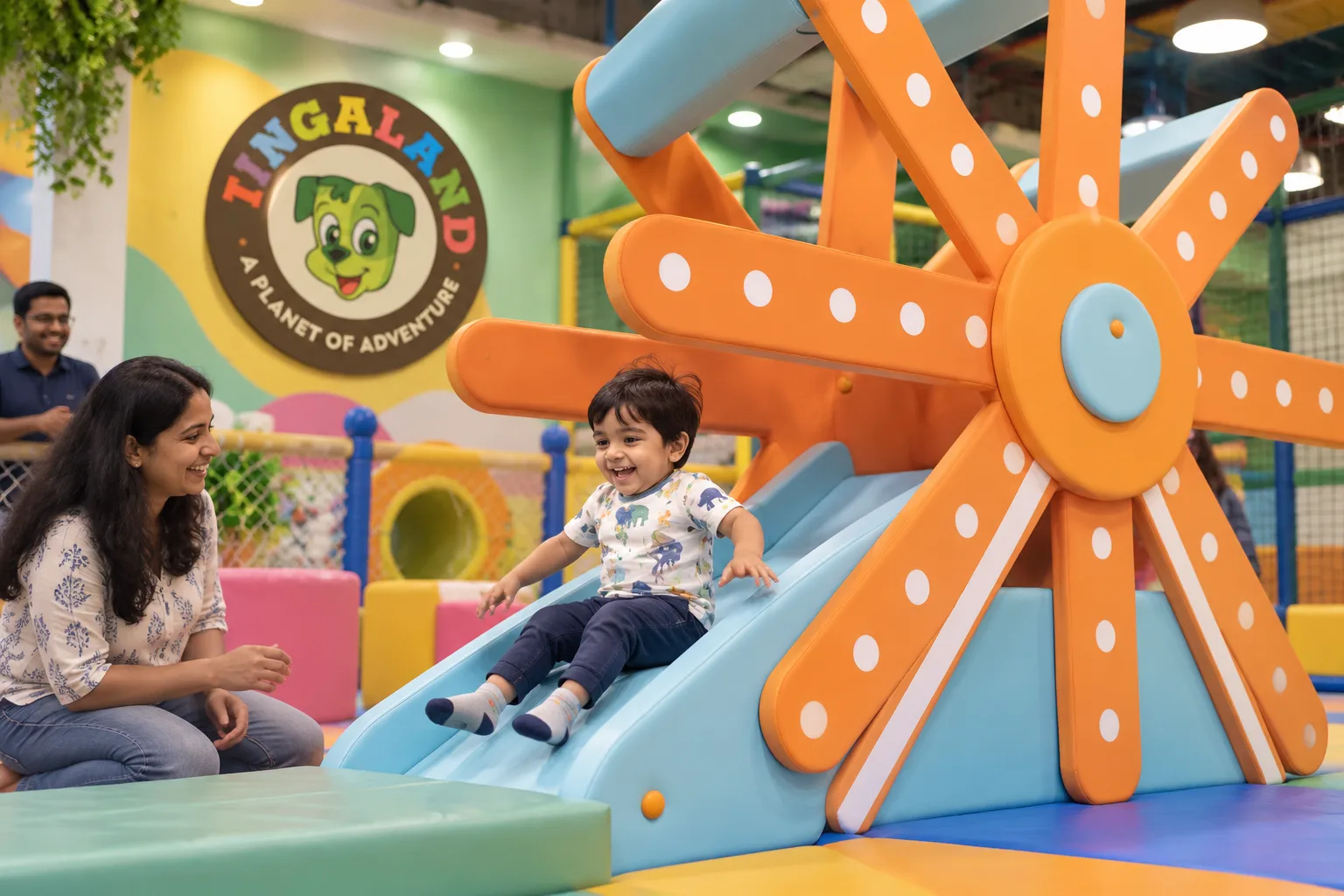 Toddler gliding down the tingaland ferris wheel slide