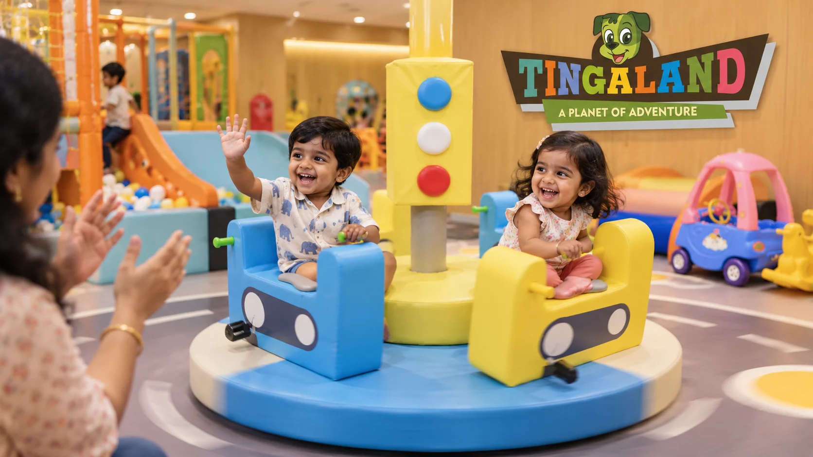 Toddlers waving during a gentle merry go round ride